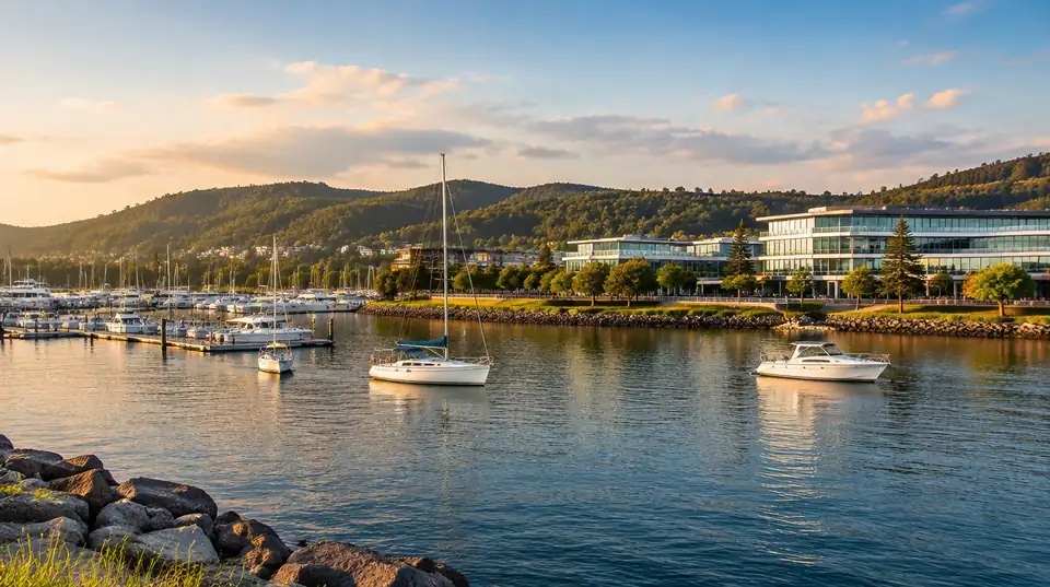 A Central Coast waterfront with boats and bushland hills